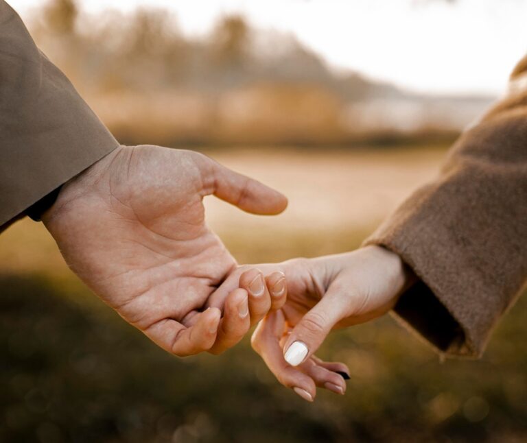 close-up-couple-holding-hands-outside-2-